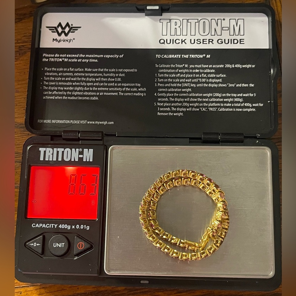 10k yellow gold pink sapphire or tourmaline not really sure which both